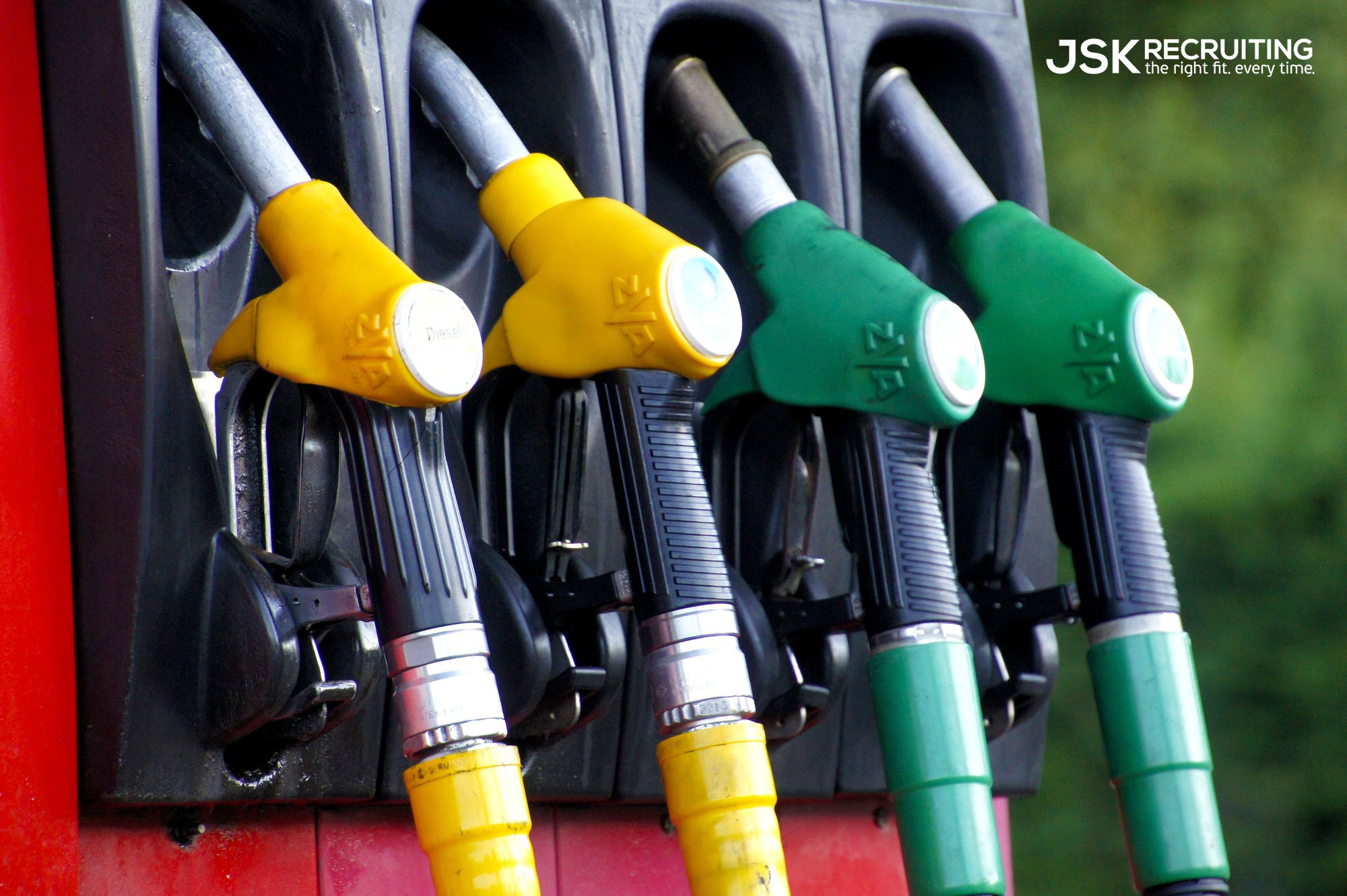 A close up of several different gas pumps.